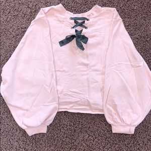 Pink Crop throw over with tied ribbon on the back